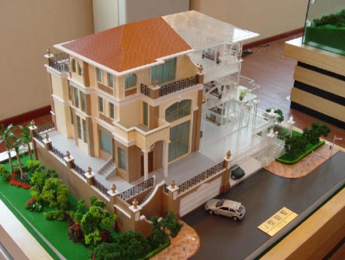 Modelos arquitectónicos miniatura del edificio comercial con el sistema de iluminación