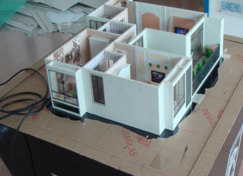 Modelos arquitectónicos miniatura del edificio comercial con el sistema de iluminación